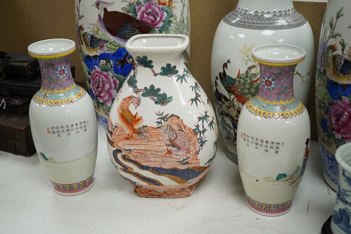 A large pair of Chinese polychrome vases, 60cm high, a pair of famille rose vases, a blue and white brushpot and two other vases (7).